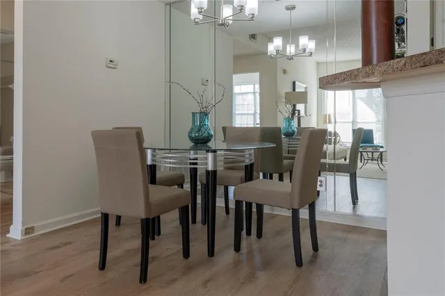 a view of a dining room with furniture and window