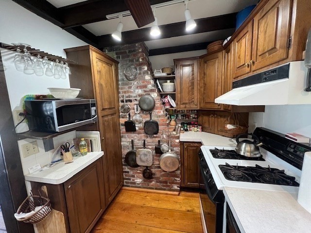 213 Main Street Chatham, MA 02633 - Photo 14 of 30 a kitchen with a sink and a stove top oven
