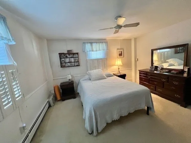a bedroom with a bed and dresser