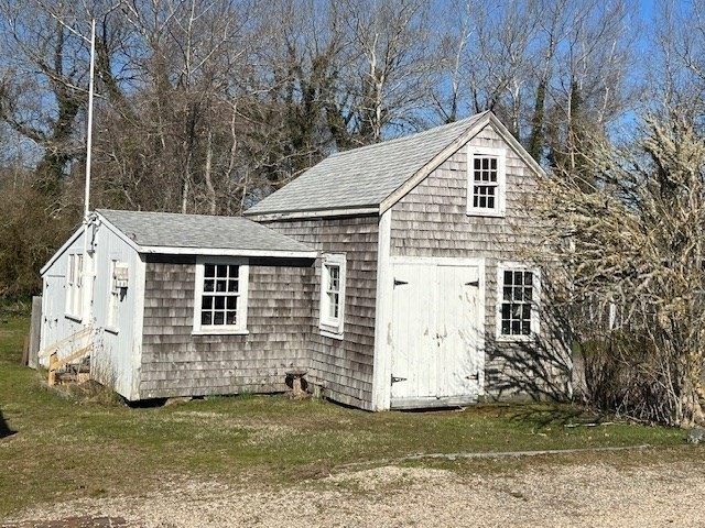 213 Main Street Chatham, MA 02633 - Photo 20 of 30 a view of a house with a yard