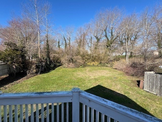 213 Main Street Chatham, MA 02633 - Photo 21 of 30 a view of a yard with wooden fence