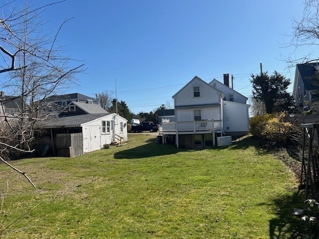 213 Main Street Chatham, MA 02633 - Photo 23 of 30 a view of a house with a yard