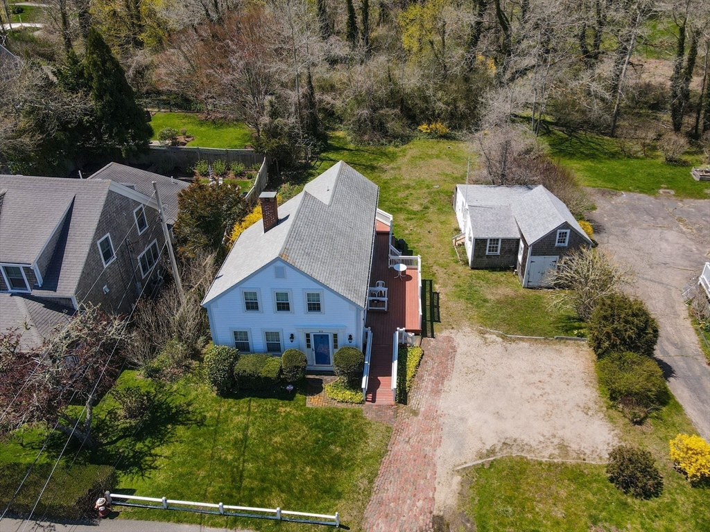 213 Main Street Chatham, MA 02633 - Photo 3 of 30 an aerial view of a house with a garden and lake view