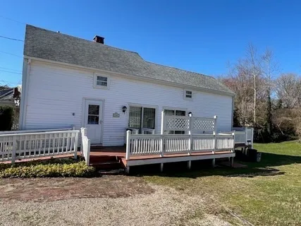 a view of a deck with a yard
