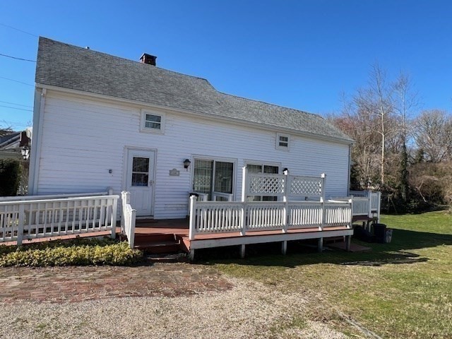 213 Main Street Chatham, MA 02633 - Photo 6 of 30 a view of a deck with a yard