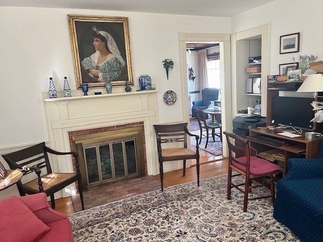 213 Main Street Chatham, MA 02633 - Photo 9 of 30 a living room with furniture a piano and a fireplace