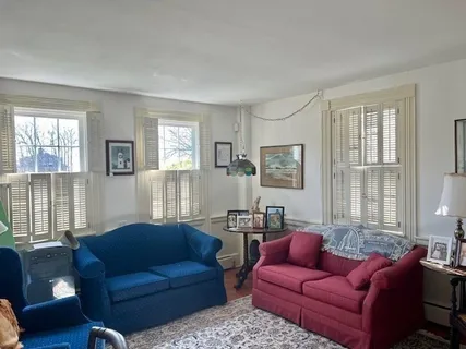 a living room with furniture and windows