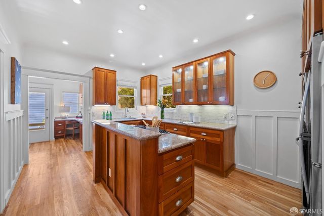 a kitchen with stainless steel appliances granite countertop a stove and a sink