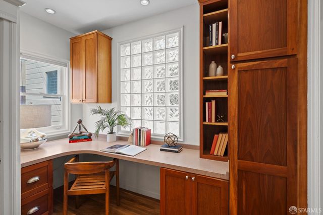 a kitchen with a sink cabinets and window