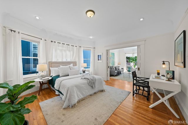 a bedroom with a bed and a table in it