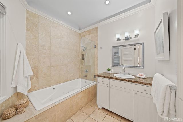 a bathroom with a toilet and a picture