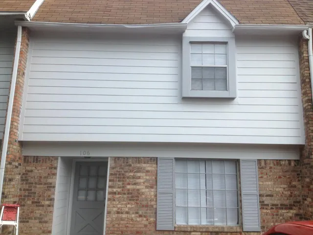 a front view of a house with white