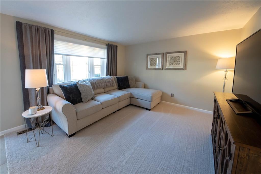 1306 Greenhill Rd Extension Pittsburgh, PA 15209 - Photo 3 of 21 Welcome guests to your tastefully decorated living room with newer carpet and contemporary paint colors.