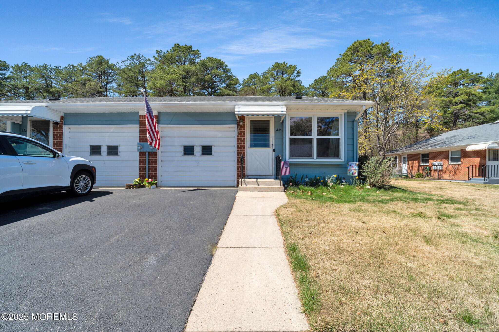 23 Molly Pitcher Boulevard, Unit B Whiting, NJ 08759 - Photo 1 of 24 front view of a house with a yard