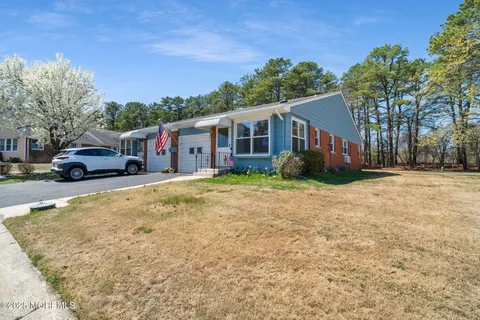 a house with trees in the background