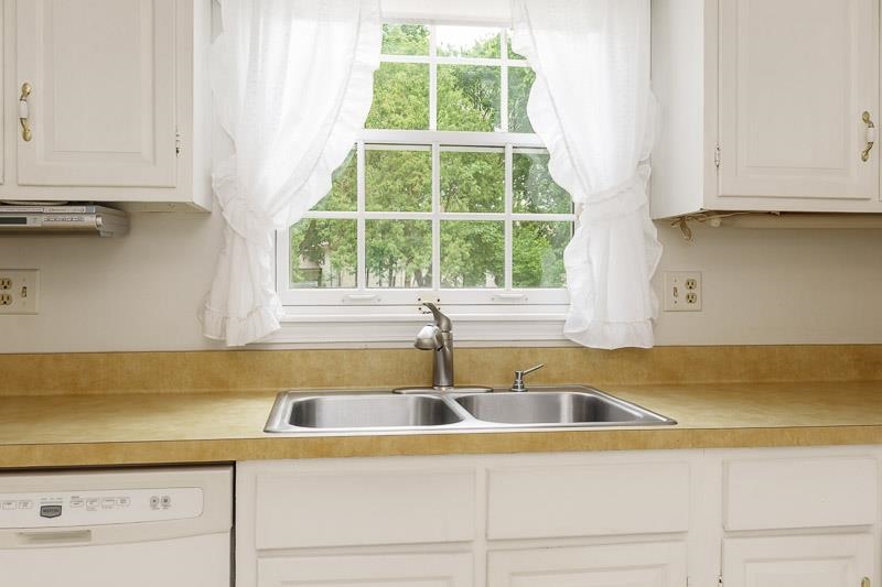 5792 Haddon Place Rockford, IL 61114 - Photo 15 of 47 a kitchen with a sink and cabinets