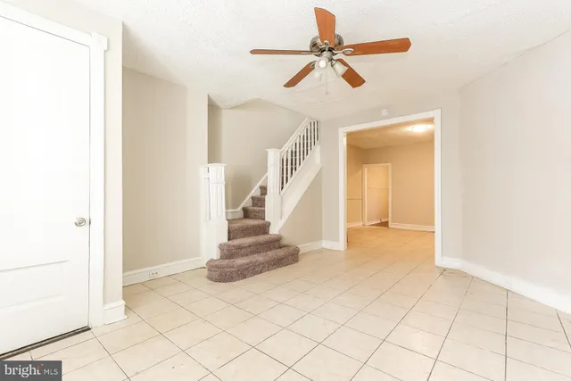 a view of entryway and hall with a workspace