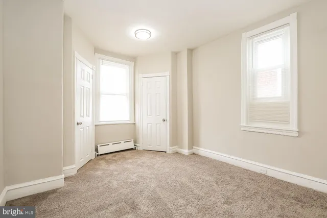 an empty room with windows