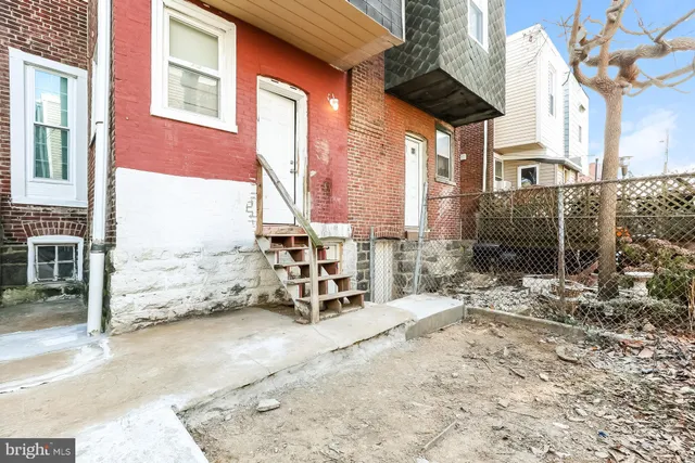 a view of a brick building with many windows