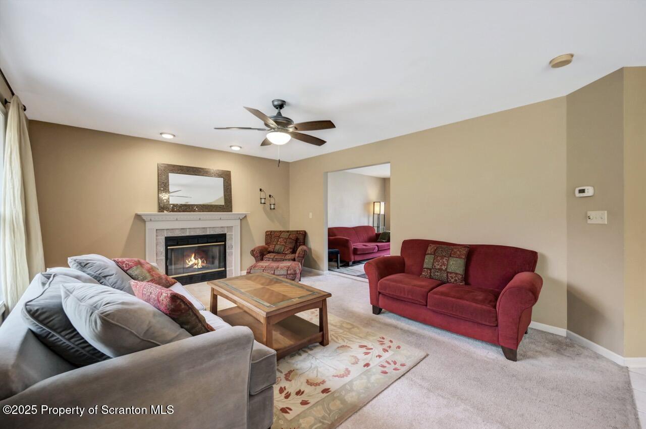 104 Beech Tree Circle Clarks Summit, PA 18411 - Photo 11 of 91 a living room with furniture and a fireplace