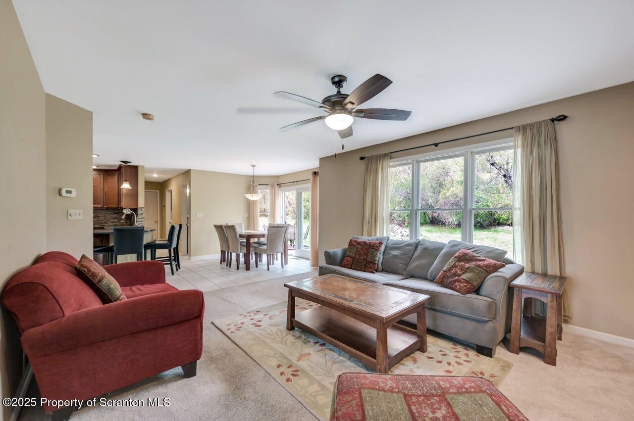 104 Beech Tree Circle Clarks Summit, PA 18411 - Photo 12 of 91 a living room with furniture and a large window