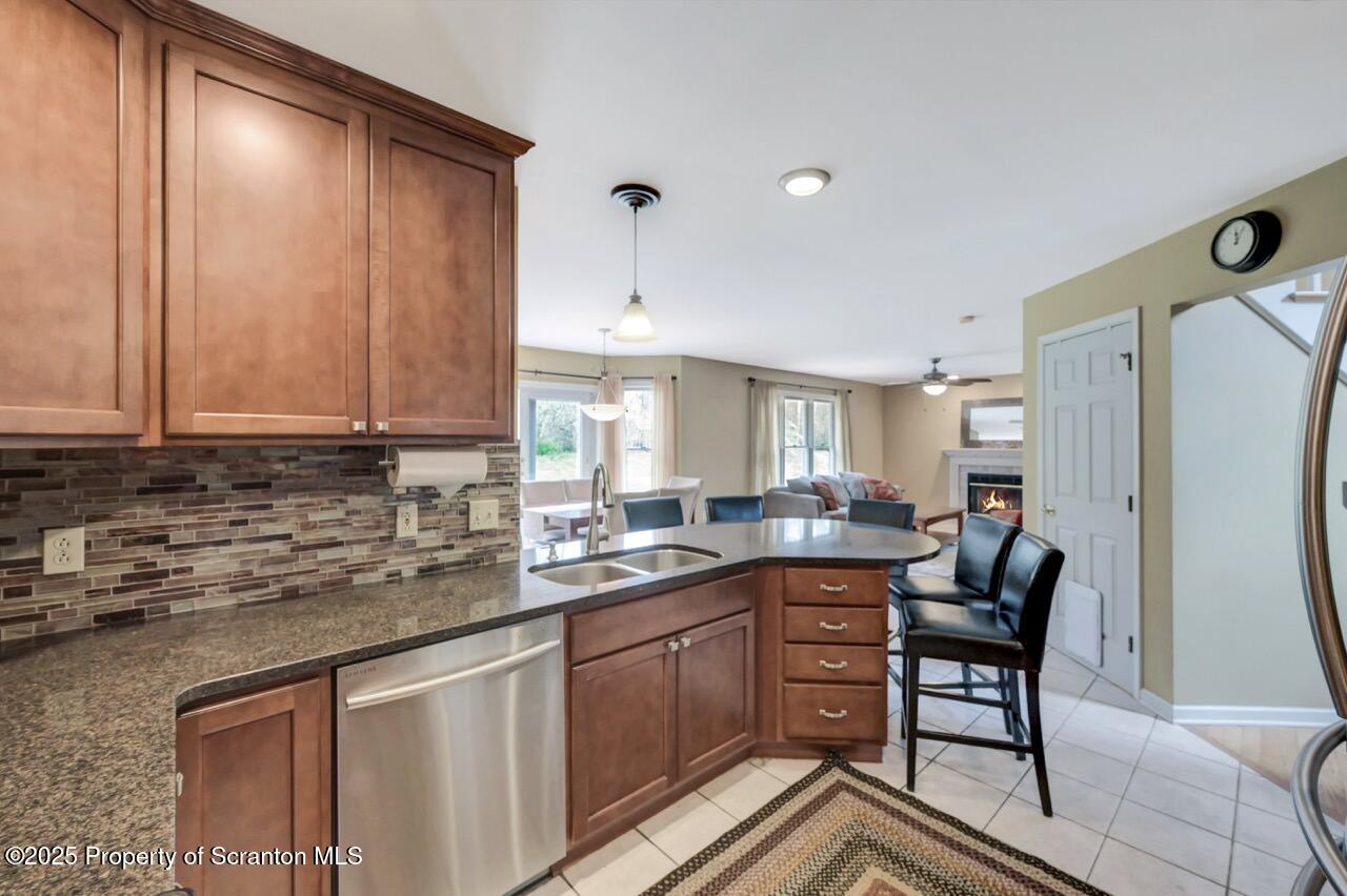 104 Beech Tree Circle Clarks Summit, PA 18411 - Photo 25 of 91 a kitchen with a sink refrigerator and cabinets