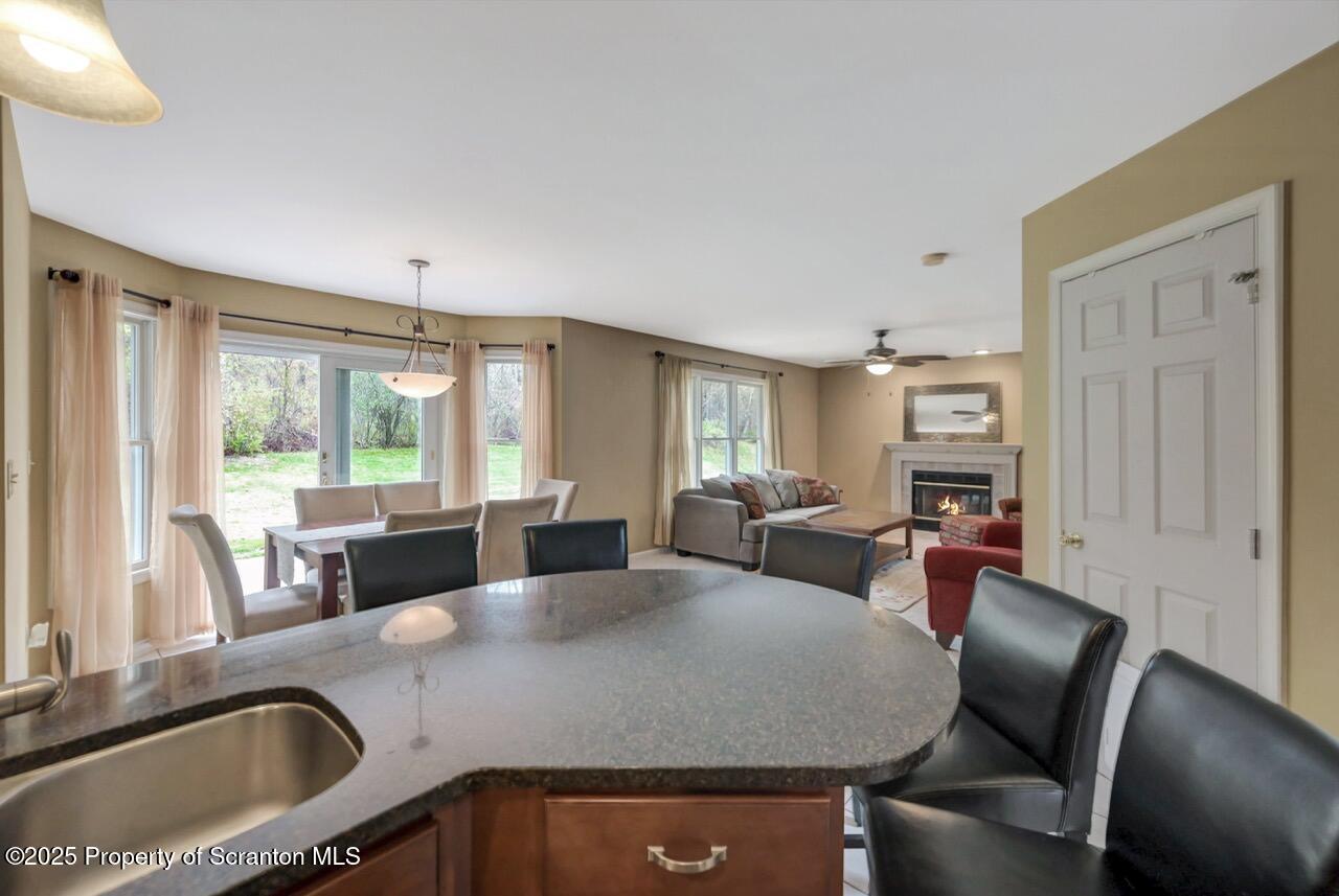 104 Beech Tree Circle Clarks Summit, PA 18411 - Photo 28 of 91 a view of a dining room with furniture and a large window