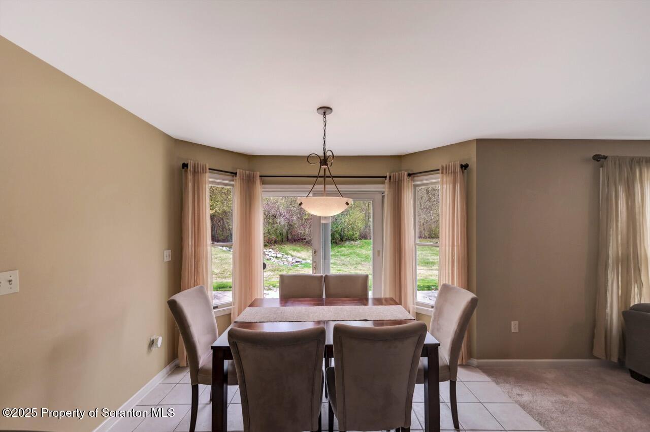 104 Beech Tree Circle Clarks Summit, PA 18411 - Photo 29 of 91 a view of a dining room with furniture window and outside view