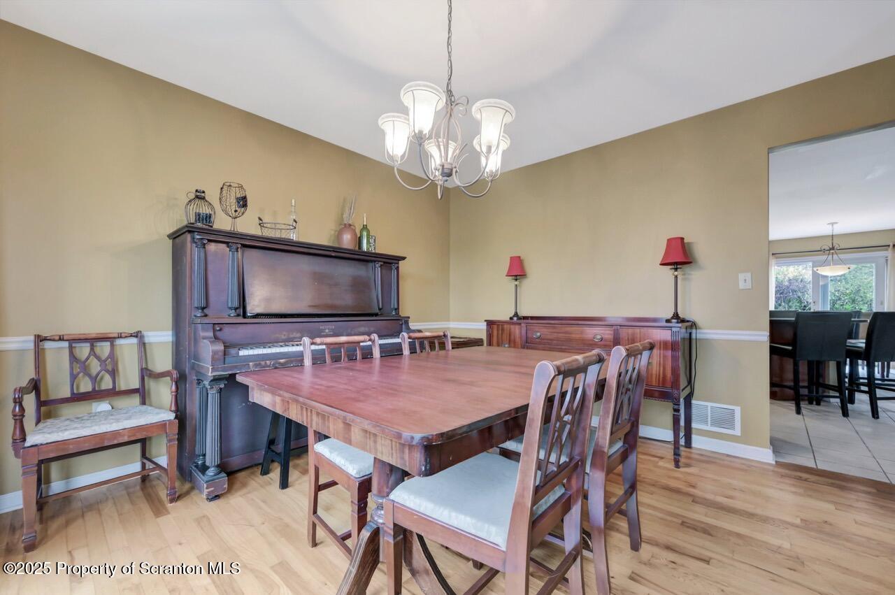104 Beech Tree Circle Clarks Summit, PA 18411 - Photo 33 of 91 a view of a dining room with furniture and wooden floor