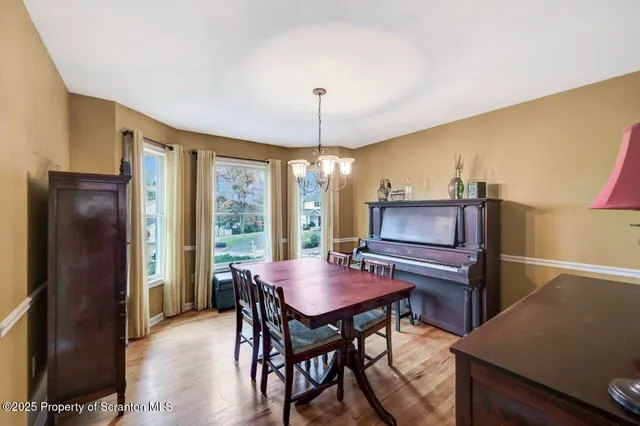 a bathroom with a tub a sink and a window
