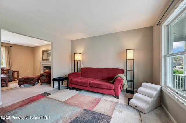 a view of a hallway view with wooden floor and staircase