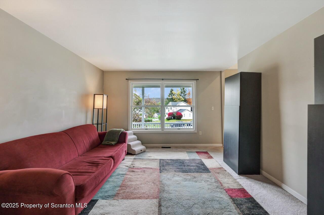 104 Beech Tree Circle Clarks Summit, PA 18411 - Photo 38 of 91 a living room with furniture and a window