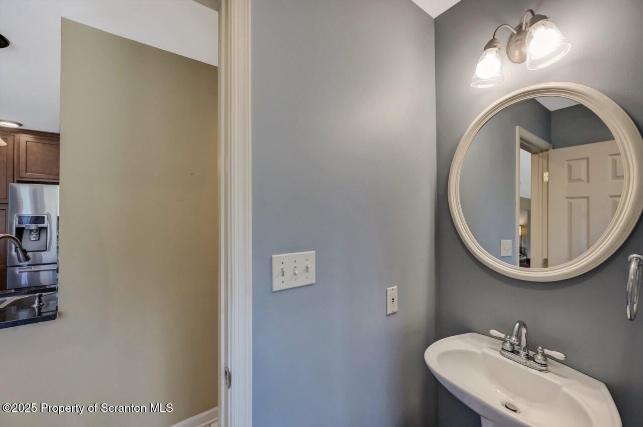 104 Beech Tree Circle Clarks Summit, PA 18411 - Photo 42 of 91 a bathroom with a sink and a mirror