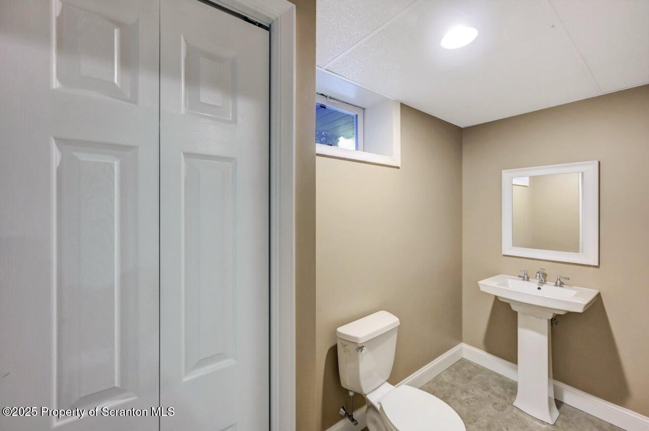 104 Beech Tree Circle Clarks Summit, PA 18411 - Photo 80 of 91 a bathroom with a toilet sink and mirror