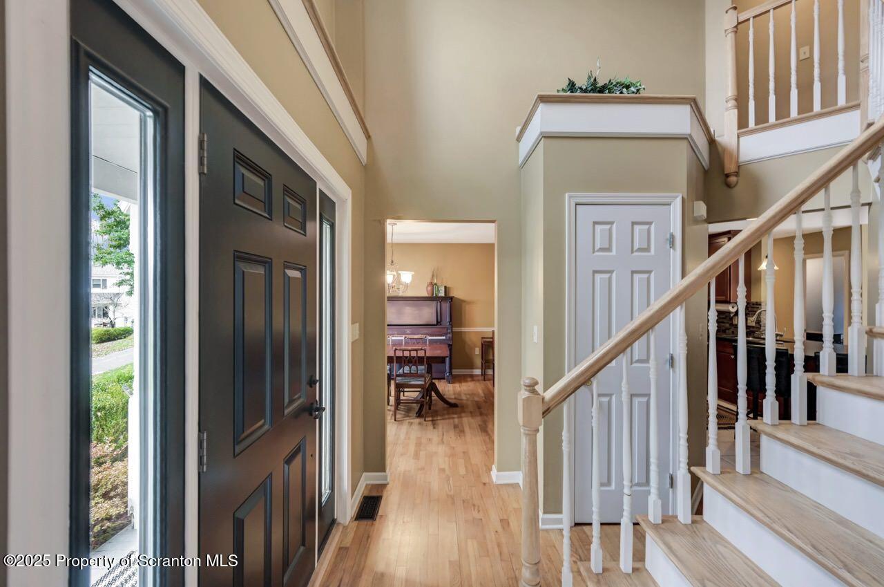 104 Beech Tree Circle Clarks Summit, PA 18411 - Photo 9 of 91 a view of hallway with wooden floor and stairs
