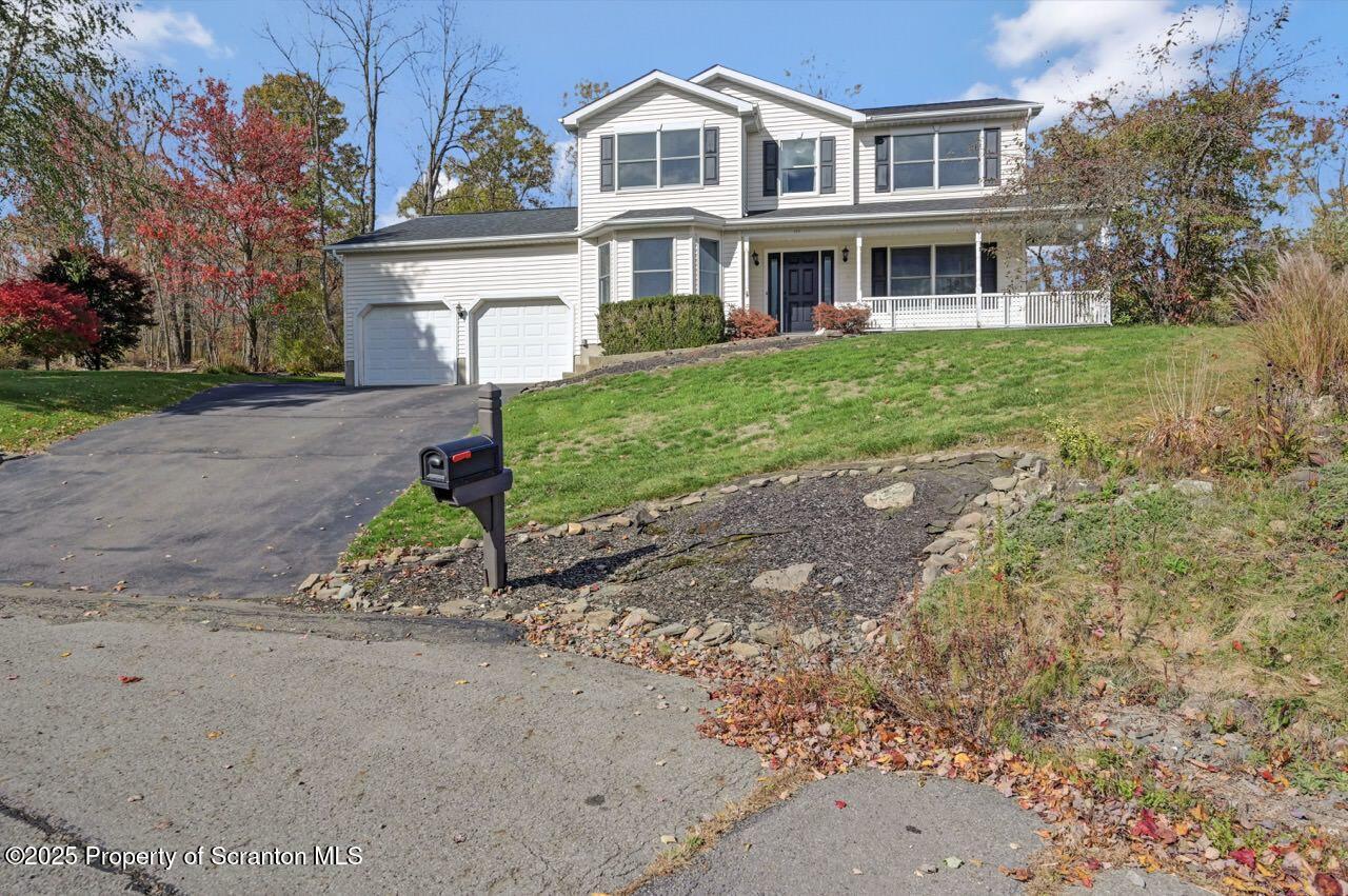 104 Beech Tree Circle Clarks Summit, PA 18411 - Photo 91 of 91 a front view of a house with a yard and a garage