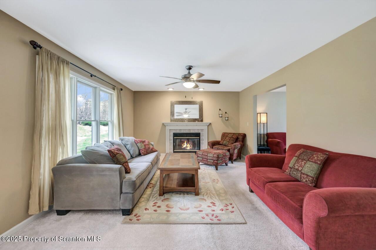 104 Beech Tree Circle Clarks Summit, PA 18411 - Photo 10 of 91 a living room with furniture large window and flat screen tv
