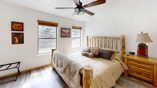 a bedroom with bed and window