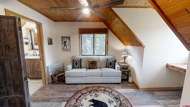 a living room with furniture and a window