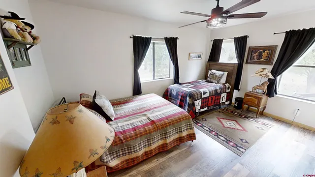 a bedroom with bed and window