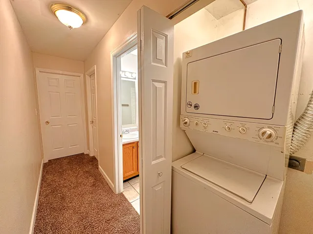 a view of storage and utility room with washer and dryer