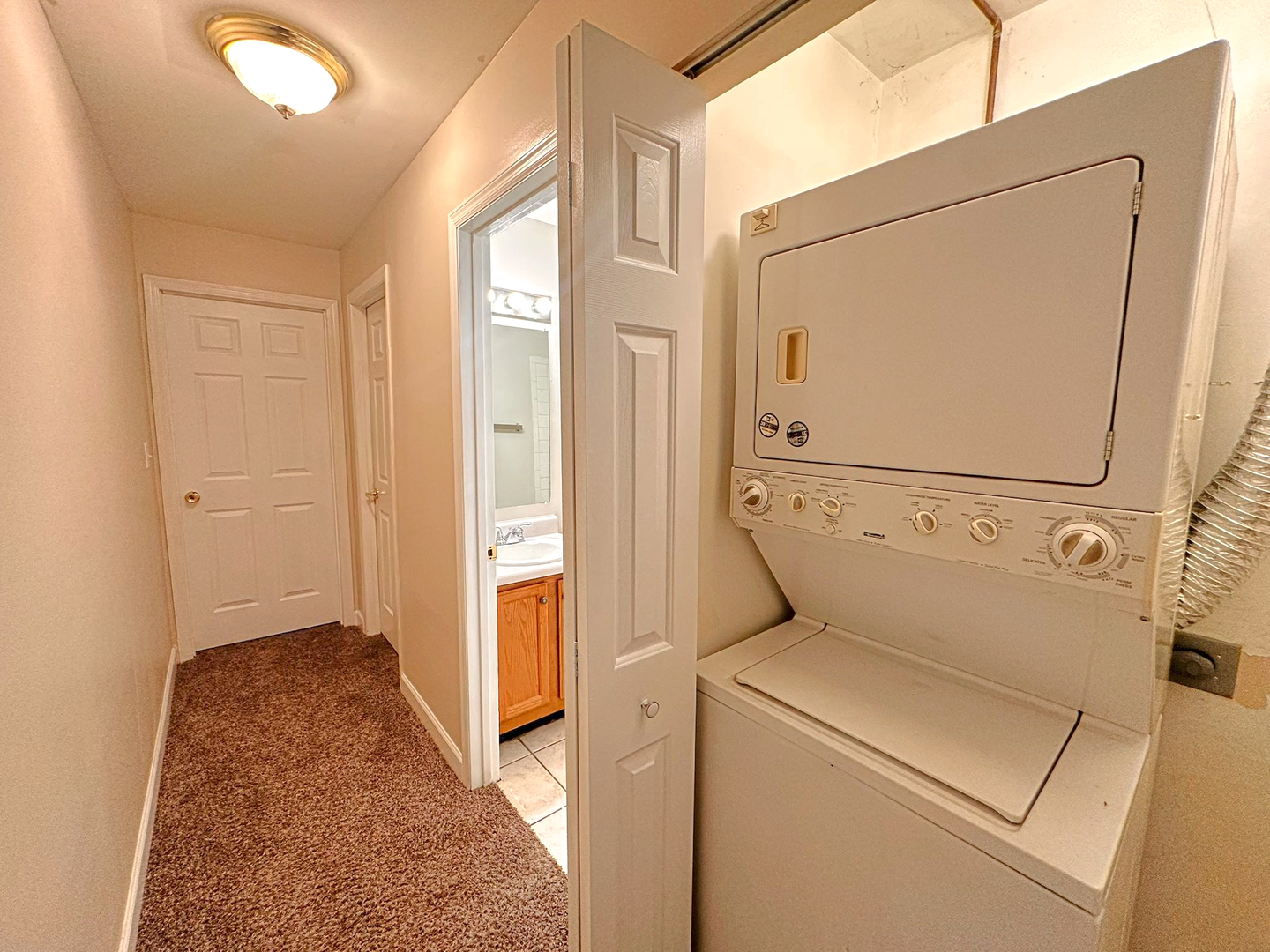8 Gant Circle, Unit D Streamwood, IL 60107 - Photo 11 of 12 a view of storage and utility room with washer and dryer