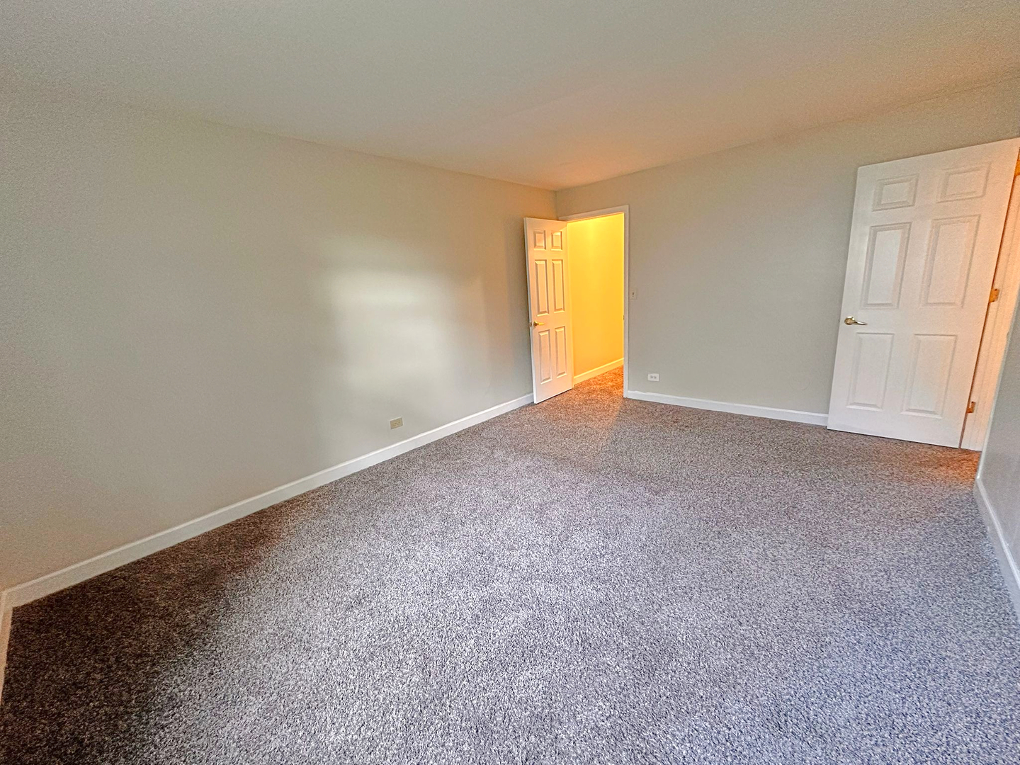 8 Gant Circle, Unit D Streamwood, IL 60107 - Photo 5 of 12 an empty room with a window and fireplace