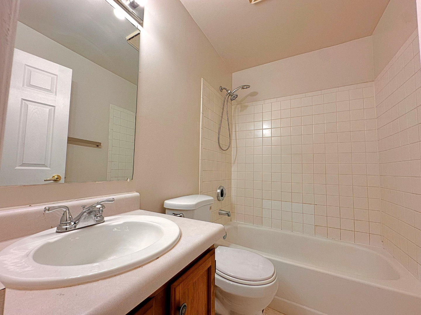 8 Gant Circle, Unit D Streamwood, IL 60107 - Photo 10 of 12 a bathroom with a sink a toilet and shower