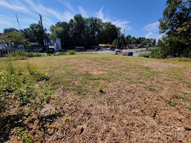 a view of a swimming pool and lounge chairs