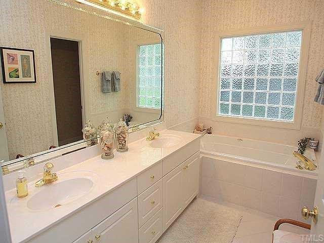 6509 Arbor Grande Way Raleigh, NC 27615 - Photo 6 of 12 Amenities of the master bath include dual vanity, tile floor, tub, and separate shower! Master Bath/Spa