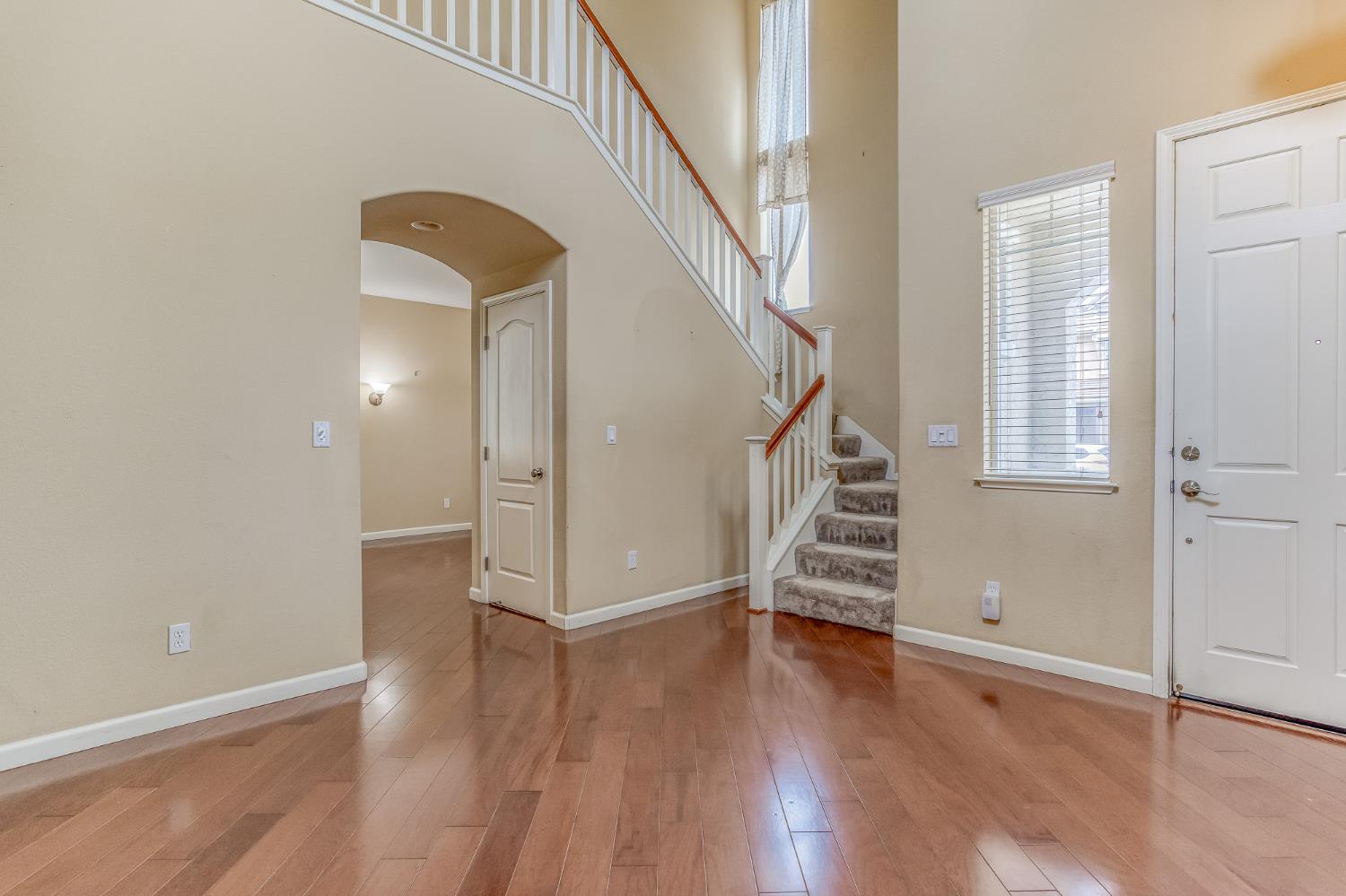 188 Thomsen Road Lathrop, CA 95330 - Photo 6 of 27 a view of entryway with wooden floor and stairs