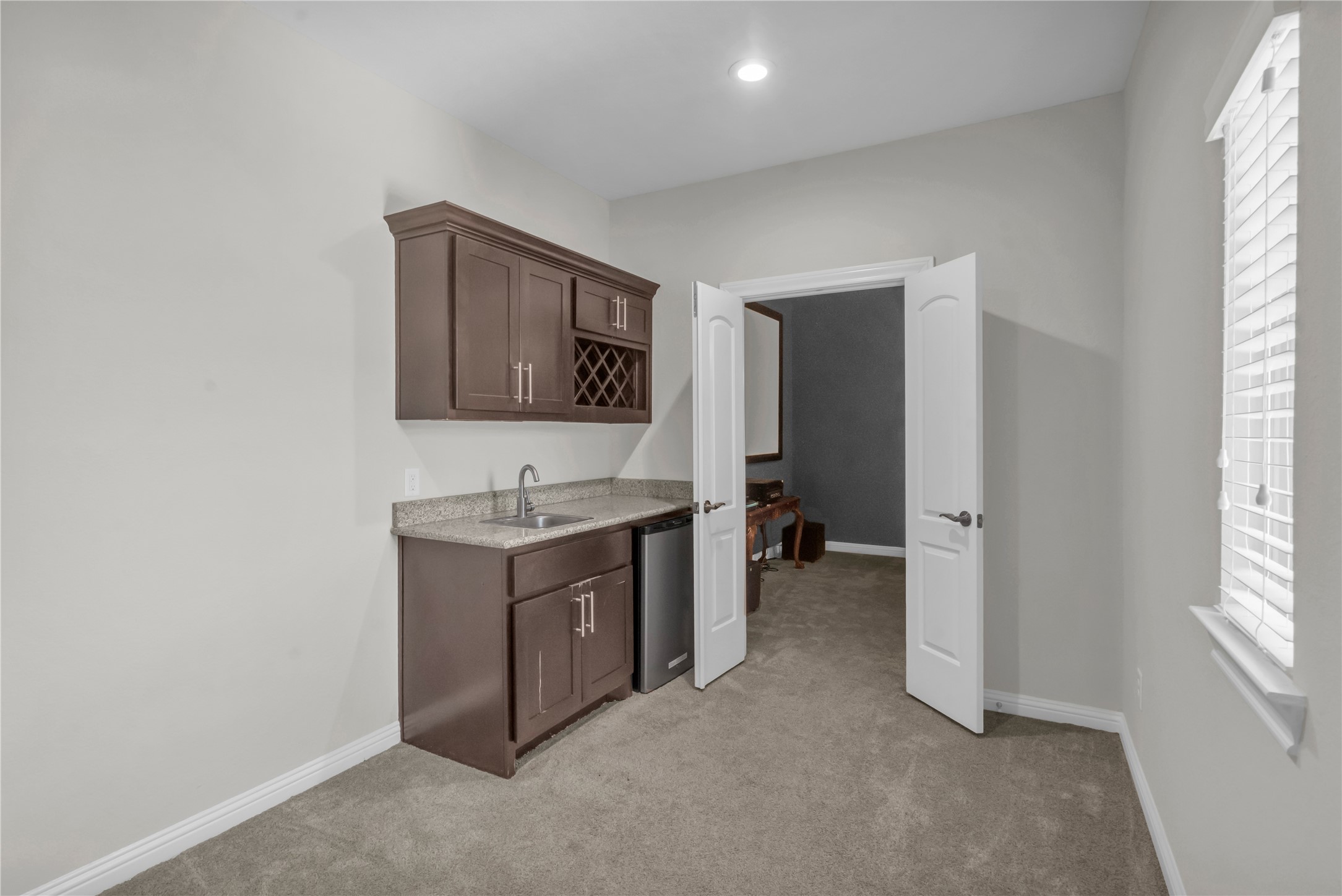 9842 Kirkstone Terrace Drive Spring, TX 77379 - Photo 22 of 34 wet bar area by the media room comes with a mini fridge!