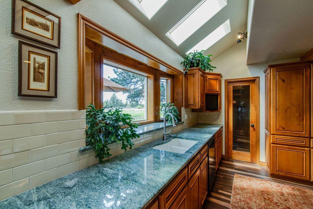 60604 Woodside Road Bend, OR 97702 - Photo 29 of 99 granite counter tops in kitchen