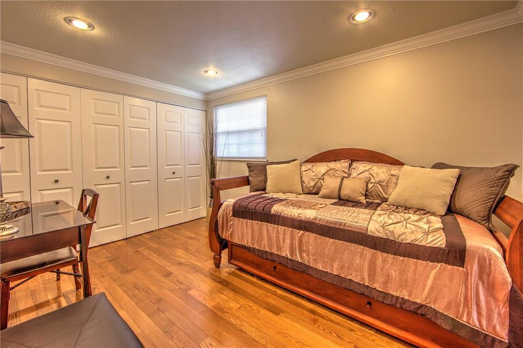 5497 Library Road, Unit 5 Bethel Park, PA 15102 - Photo 12 of 15 Second bedroom boasts hardwood floors, recessed lighting, lots of cabinet space.